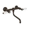 Wall Mount Bridge Lavatory Faucet with Porcelain Levers and Low Swinging Spout in Tuscan Brass