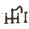 Deck Mount Column Spout 3 Leg Bridge Kitchen Faucet With Sidespray And Porcelain Lever Handle In Tuscan Brass