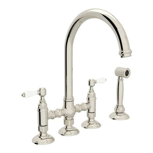 Deck Mount C-Spout 3 Leg Bridge Kitchen Faucet With Sidespray And Porcelain Lever In Polished Nickel