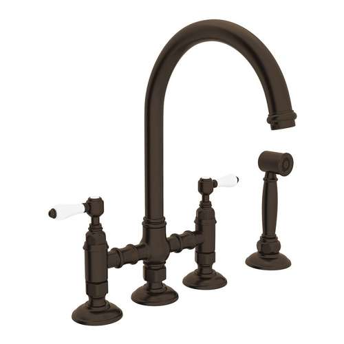 Deck Mount C-Spout 3 Leg Bridge Kitchen Faucet With Sidespray And Porcelain Lever In Tuscan Brass