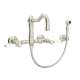 Wall Mount Column Spout Bridge Kitchen Faucet With Sidespray And Porcelain Lever Handle In Polished Nickel